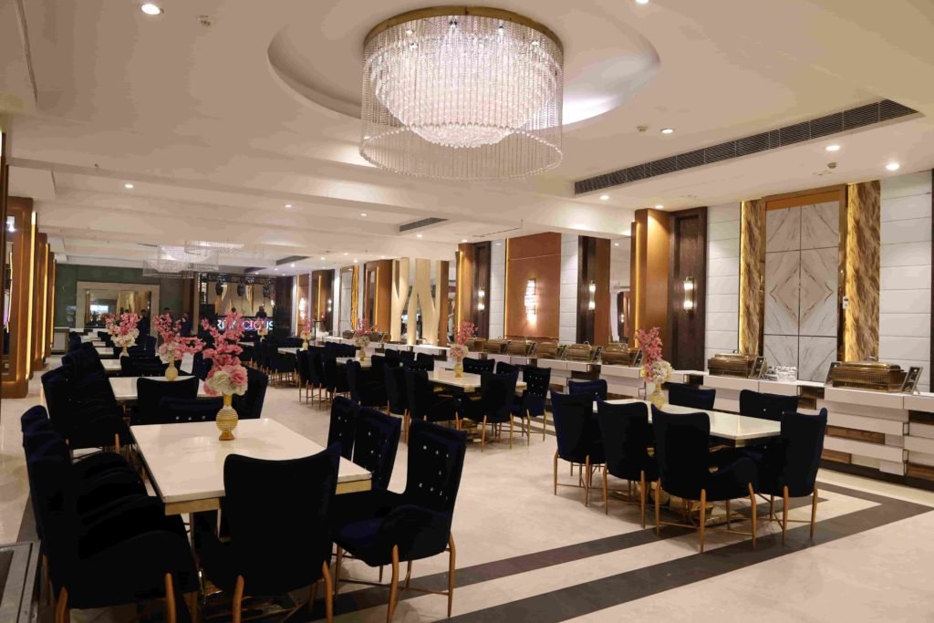 Luxury banquet hall dining setup with floral table decorations for birthday party